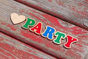 love party sign on aged wooden board photo