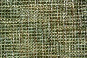 Color fabric texture. Woolen soft crumpled fabric of a green shade. Copy space. photo