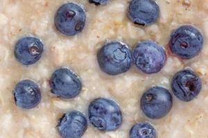 close up of oatmeal porridge with blueberries photo