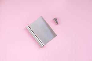 A professional set of spatulas for icing large cakes and a nozzle for cream. Confectioner's tools photo