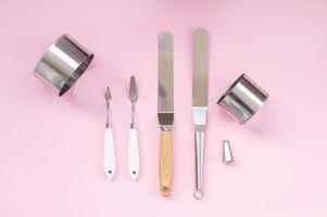 Professional spatula set for quick glazing of large cakes. Confectioner's tools, metal biscuit ring photo