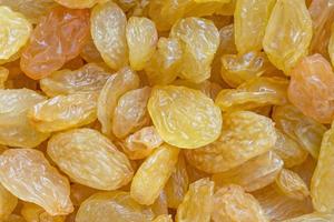 close up of heap of golden raisins photo