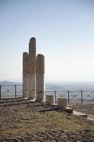 Ancient Ruins of Pergamon Acropolis. Ancient city column ruins with the cityscape in the background. photo