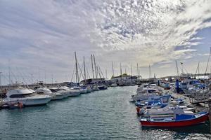 landscape with harbor and yachts on the spanish canary island of fuerteventura on a sunny day photo