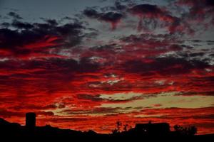 sky after sunset with bright orange clouds photo