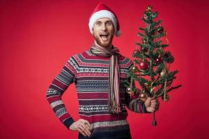 handsome man in a santa hat Christmas decorations holiday New Year studio posing photo