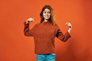 woman in red sweater lifestyle glamor cosmetics red background photo