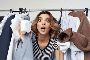 pretty woman trying on clothes shop retail isolated background photo