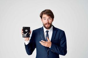 business man in suit and technology hard drive information photo