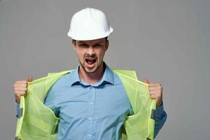 man in construction uniform Professional Job light background photo
