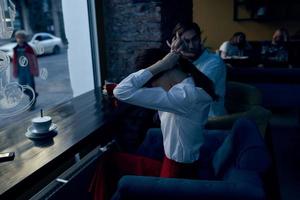 woman in a white shirt and in a red skirt in a restaurant top view photo