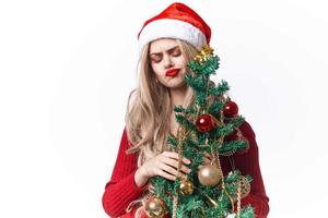 mujer vestido como Papa Noel claus Navidad árbol fiesta Navidad foto