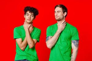 two man holding his neck emotions discontent red background photo