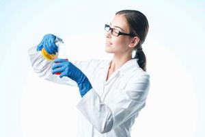 female laboratory assistant chemical solution analyzes biology professional photo