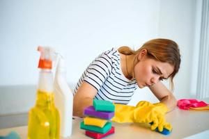 Woman cleans sponge table household cleaning service lifestyle photo