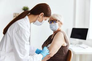 elderly woman vaccine passport drug injection photo