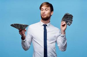 man in shirt with tie finance money self confidence blue background photo