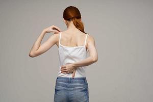woman back pain health problems osteoporosis isolated background photo