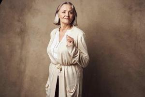 elderly woman close-up posing fashion studio photo