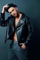 man in black leather jacket fashion modern style luxury dark background photo