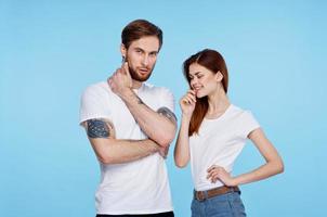 young couple in white t-shirt fashion modern style blue background photo