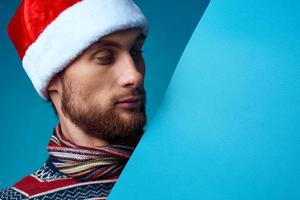 Cheerful man in a christmas blue mockup Poster isolated background photo