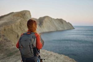 woman travels in the mountains with a backpack walk landscape fresh air photo