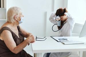 elderly woman patient at the doctor health care photo