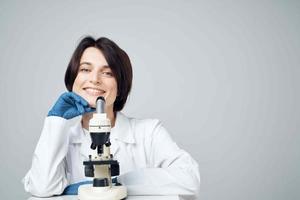 woman laboratory assistant microscope science research studio photo