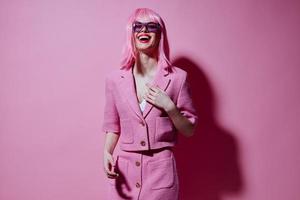 Portrait of a charming lady gesturing with hands pink jacket lifestyle glamor Studio Model unaltered photo