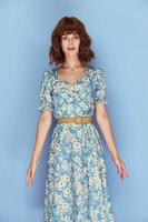 Woman in flower dress Look forward at the seams short photo