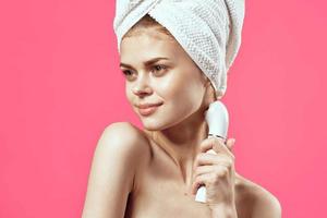 woman with towel on head naked shoulders massage medicine cosmetics photo