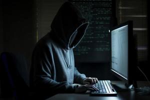 Hacker work at computer in hoodie. Generate Ai photo