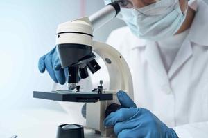 woman laboratory assistant microscope diagnostics research science photo