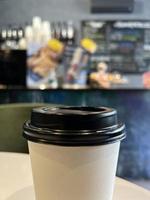 Coffee cup on a blurred background. Hot drink. photo