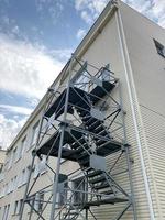 Fire ladder on the building. Architecture and security. photo