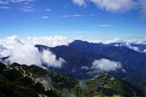 Skyline Landscape view of Old Silk Route Zig Zag Road with Himalayan Mountain Range in Background photo