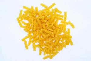 Uncooked rotini pasta isolated on white background,pasta spiral or fusilli closeup photo
