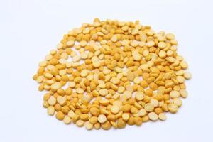 Chana dhal yellow lentil split yellow chickpea lentil fresh natural yellow lentils with white background photo