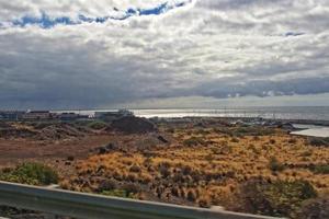 landscapes from the Spanish island of Tenerife with the highway and the ocean photo