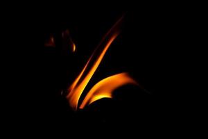 Fire flame texture. Burning material backdrop. Burn effect pattern. Blaze and torch wallpaper. Heat and haze backdrop. photo