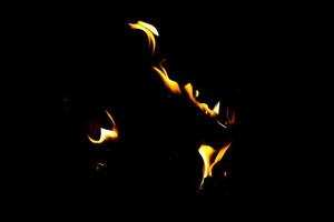 Fire flame texture. Burning material backdrop. Burn effect pattern. Blaze and torch wallpaper. Heat and haze backdrop. photo