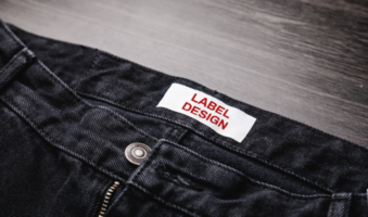 Blank clothing label on denim jeans texture. Label with empty space for text psd