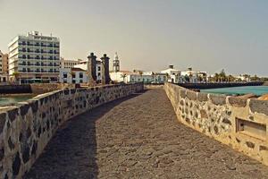 seaside landscape from the capital of the Canary Island Lanzarote Arrecife in Spain on a sunny warm summer day photo