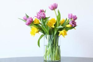 Tulips and narcissus in vase, home decor photo