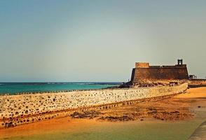 seaside landscape from the capital of the Canary Island Lanzarote Arrecife in Spain on a sunny warm summer day photo