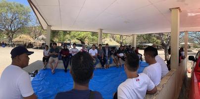 Atambua, Nusa Tenggara Timur, 2022 A group of tourists sitting discussing each other in the pavilion photo