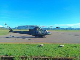 Atambua, Nusa Tenggara Timur, 2023 Indonesian National Armed Forces TNI Army helicopter parked on the airport runway helipad photo