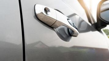 Close of open chrome door of gray color. parking at outdoor in the eveing time. photo