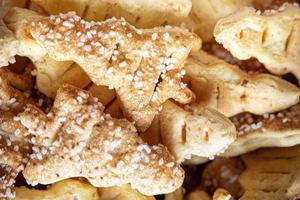 tasty background of cinnamon cakes from puff pastry in the shape of a Christmas tree in close-up photo